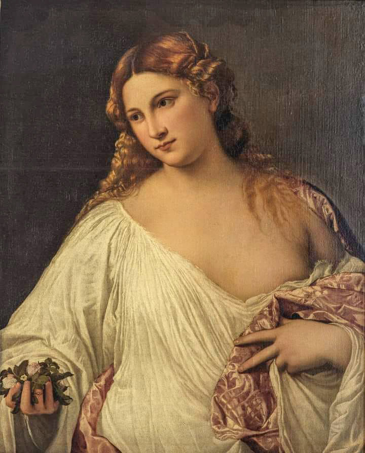 Classical painting of a young woman in a white gown holding flowers