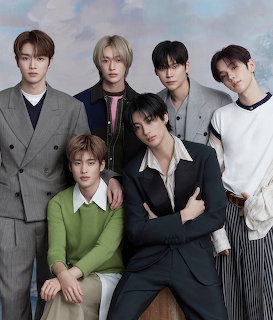 Six members of K-pop group RIIZE posing together in a styled group portrait