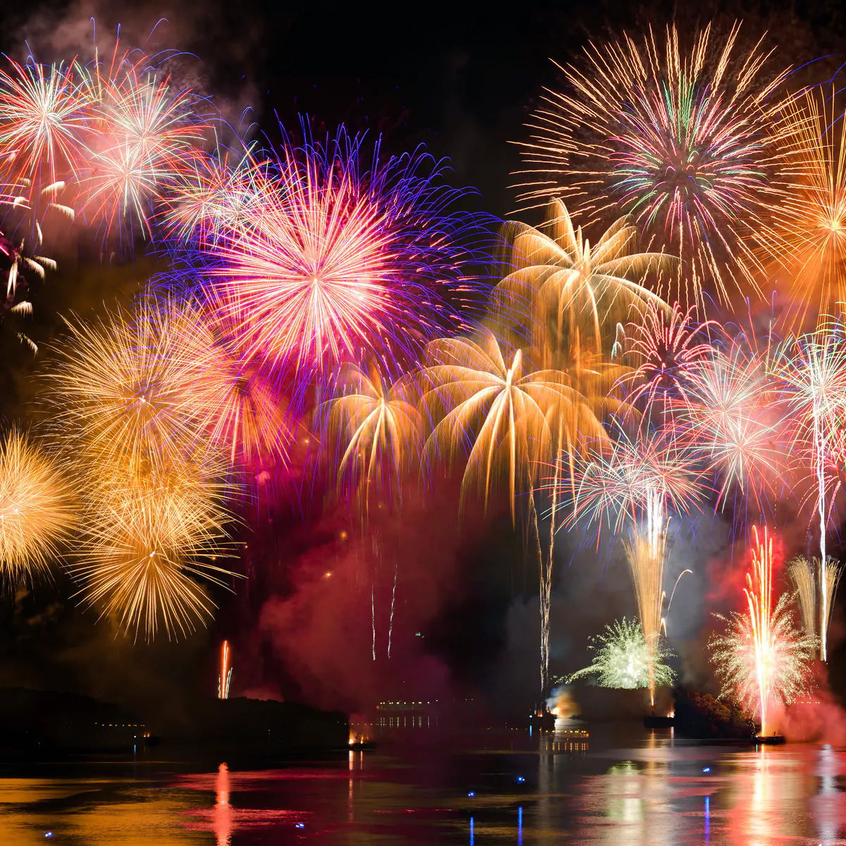 Colorful Fireworks Over Water