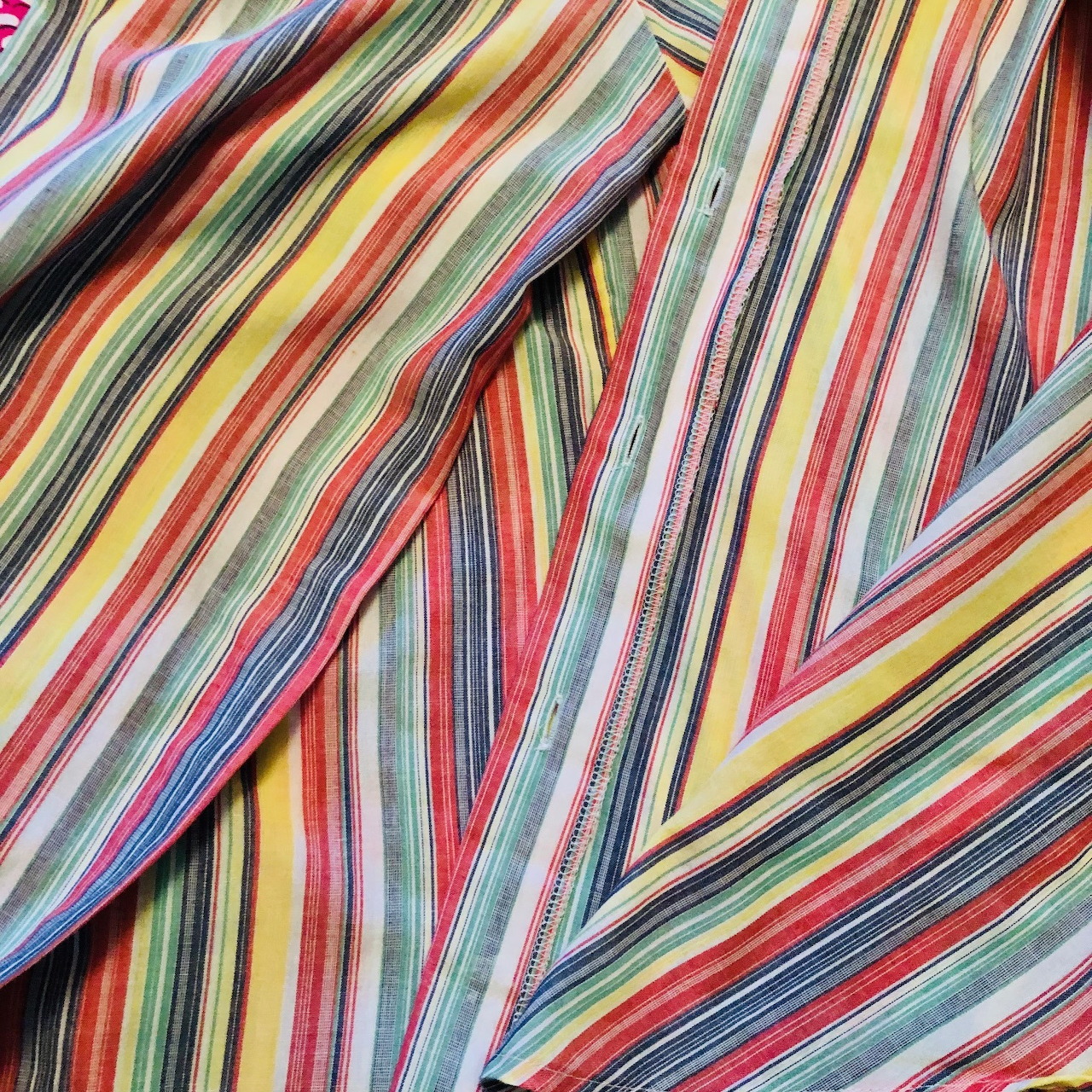 Close-up of vintage striped fabric with diagonal multicolor lines