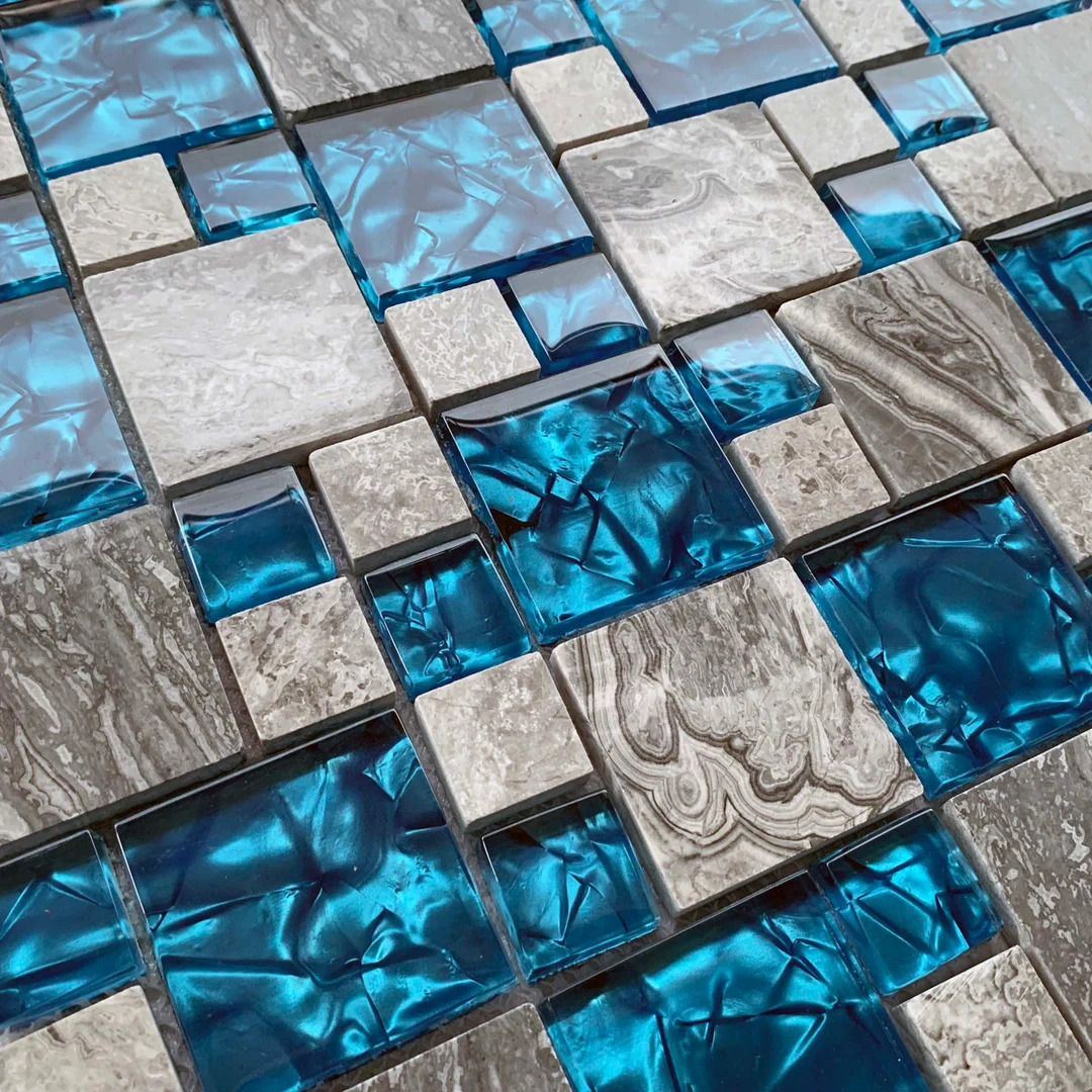 Abstract mosaic of blue glass and gray stone square tiles