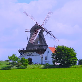 Traditional Windmill on Green Field