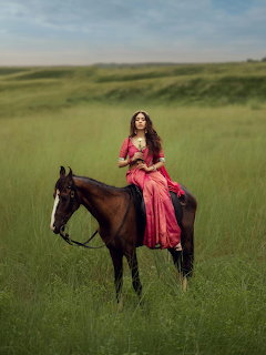 Woman on Horse in Green Field
