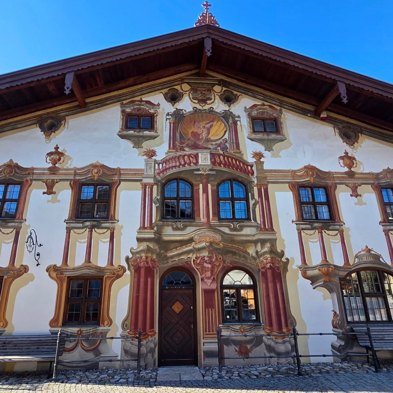 Ornate painted Bavarian house in Oberammergau with colorful frescoes and decorative facades