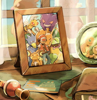 Framed Pokemon character illustration on a desk next to a green pocket watch