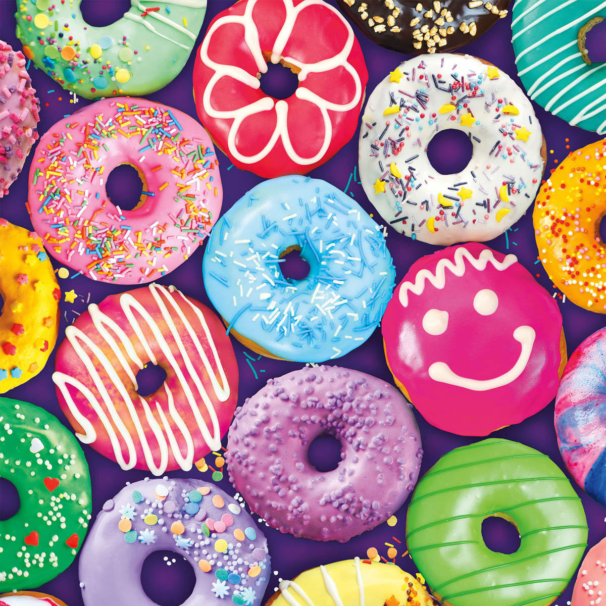 Colorful assorted donuts with frosting and sprinkles arranged in a group