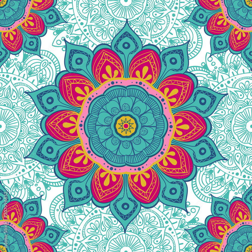 Ornate mandala with turquoise and pink flower petals in symmetrical geometric design on decorative white background