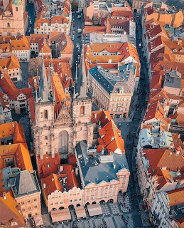 Aerial view of Prague Old Town with Týn Church and orange rooftops