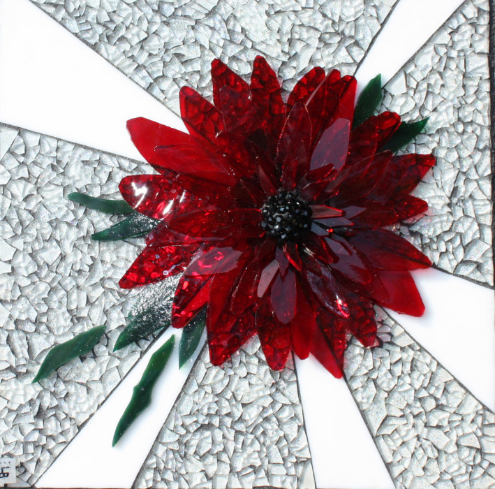 Mosaic art of a red flower with petals radiating from dark center on white textured background