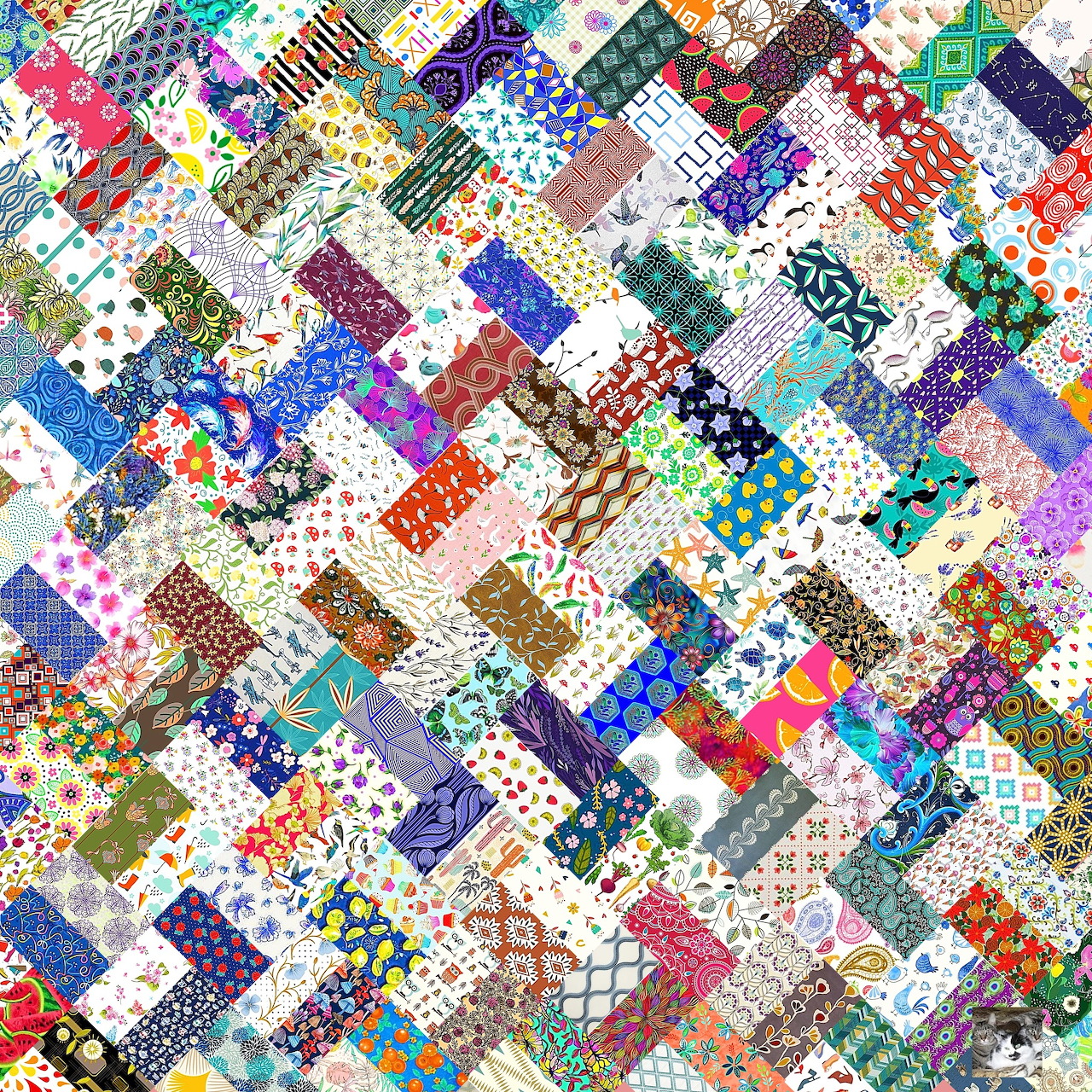 Diagonal patchwork quilt with colorful fabric squares in various patterns including florals, dots, and geometric designs