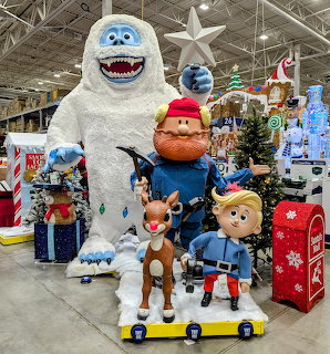 Christmas store display with Rudolph the Red-Nosed Reindeer characters including Bumble, Yukon Cornelius, and Hermey