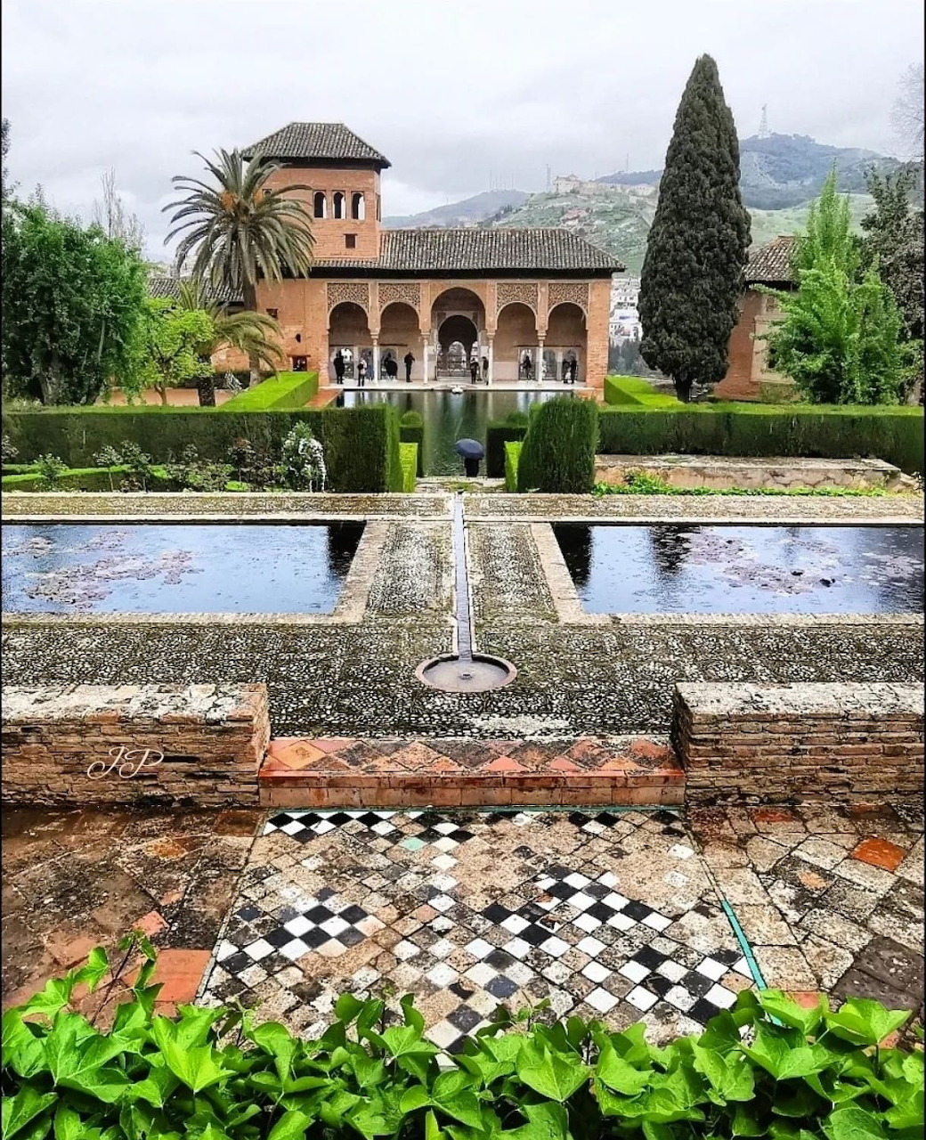 Manicured gardens and hedges inside the Alhambra palace grounds in Granada
