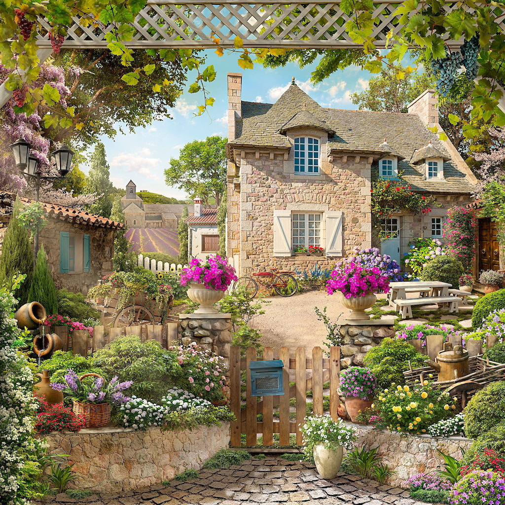 Stone cottage with blooming garden, white fence, and sunny blue sky