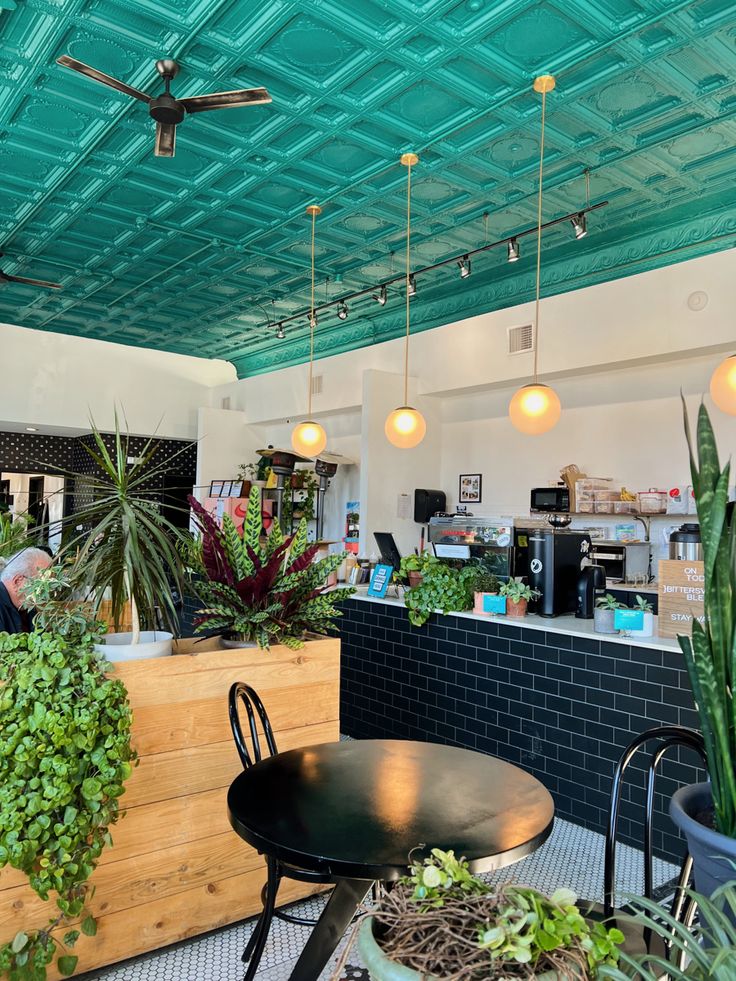 Interior of a cozy coffee shop in Wichita, Kansas with wooden tables and warm lighting.