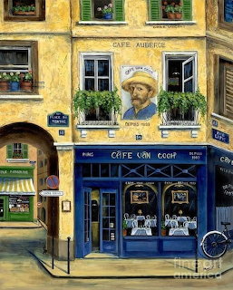 Blue cafe storefront with Van Gogh portrait mural on yellow Parisian building