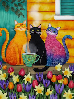 Three decorative cats in orange, black, and gradient purple sitting together on a windowsill with colorful spring flowers below