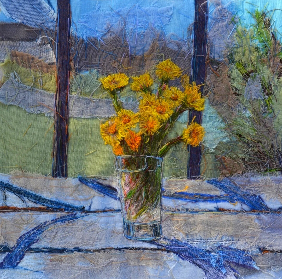 Oil painting of yellow flowers in glass vase on blue striped tablecloth with window behind