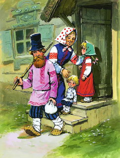 Children in colorful folk dress standing by a cottage door