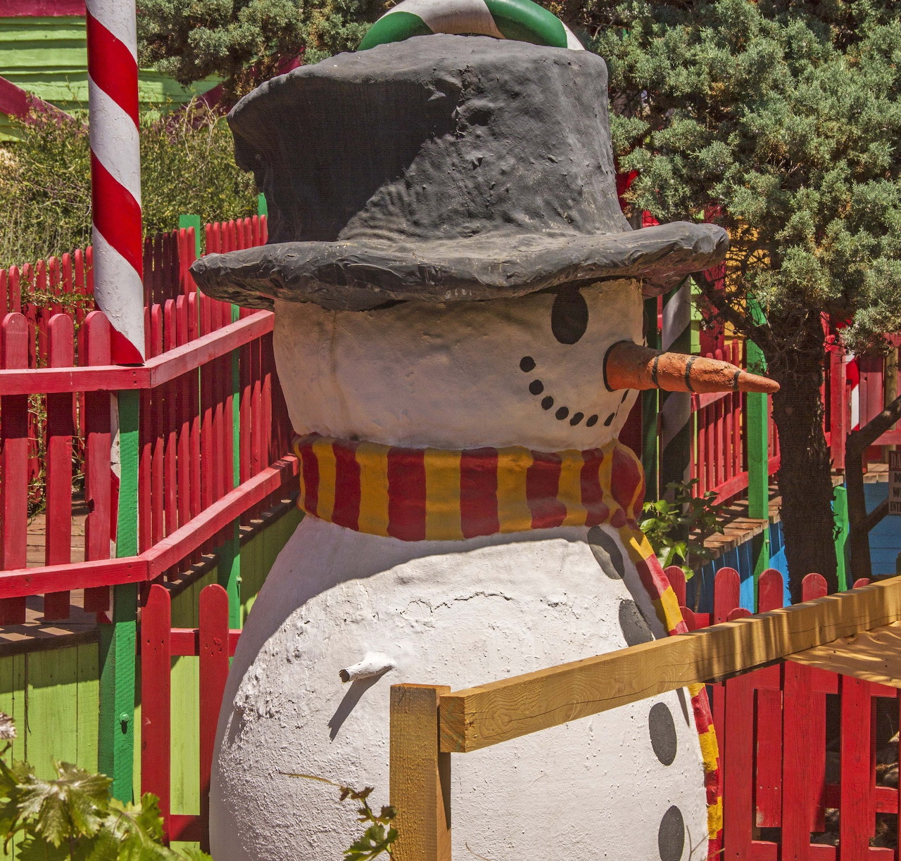 Snowman statue with top hat at colorful Popeye Village Malta
