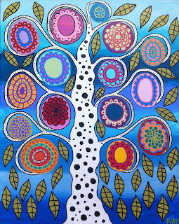 Folk art tree with vibrant patterned circles as leaves and decorative foliage on blue background