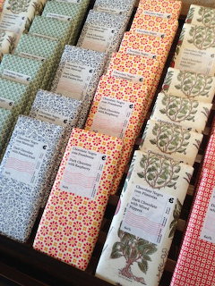 Patterned Portuguese chocolate bars lined up in rows with colorful decorative wrappers