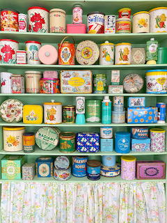 Vintage Tin Collection on Shelves
