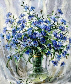 Painting of blue cornflowers in a glass vase with green stems and leaves