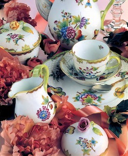 Collection of Herendi porcelain tea set with colorful floral designs and rose decorations