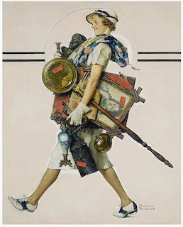 Woman in white dress carrying stack of antique items including paintings, clocks, and decorative objects