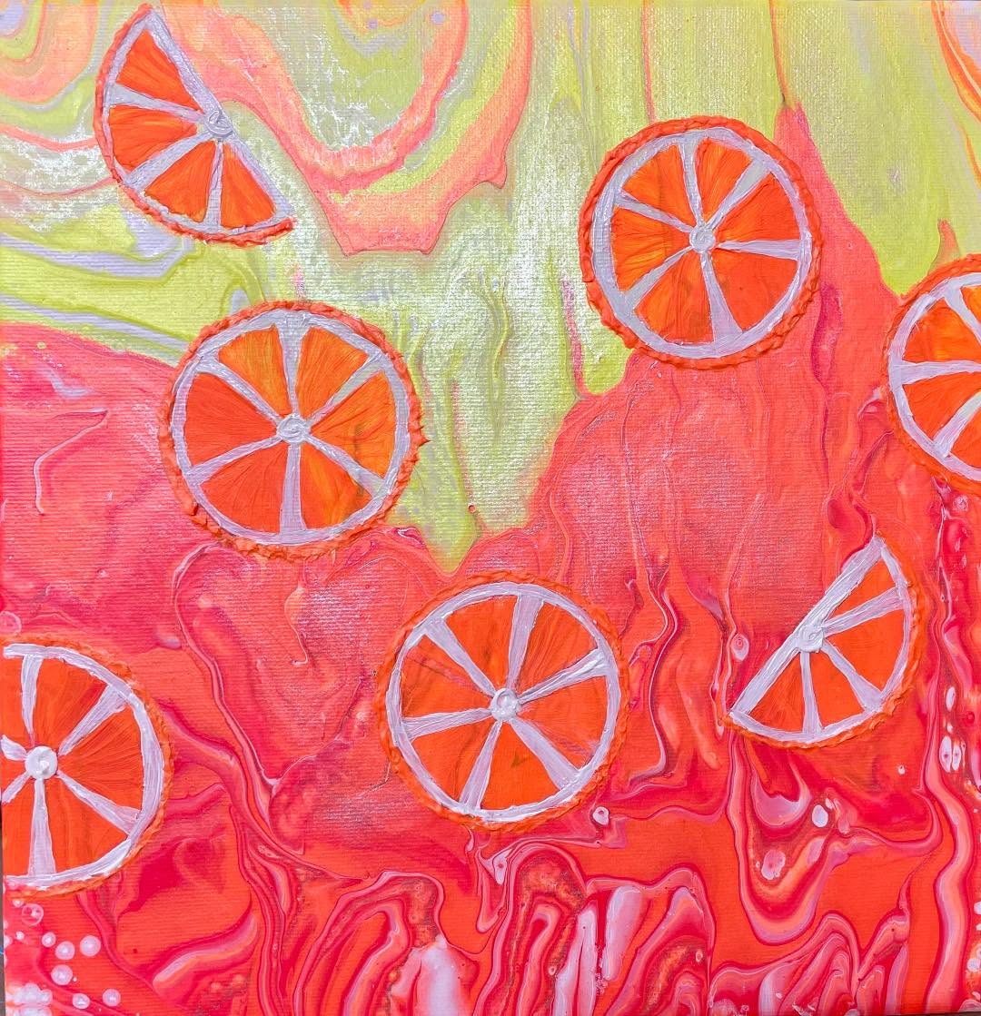 Abstract art with orange citrus slices in swirling pink, coral, yellow and green paint
