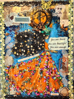 Mixed media collage with layered papers, beads, fabric patches and text in vibrant blue, orange and gold colors