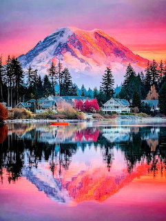 Snow-capped Mount Rainier reflecting in still lake water under vivid pink sunset sky with silhouetted pine trees