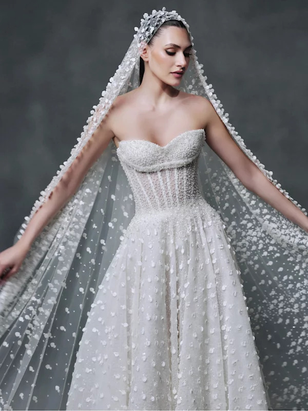 Bride in a white wedding gown posing for a portrait