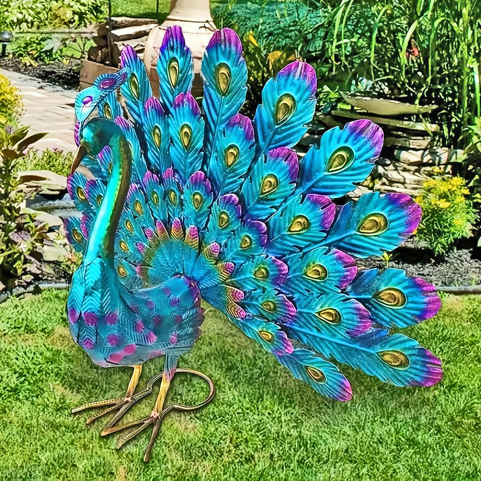 Colorful metal peacock yard art on green grass in a garden