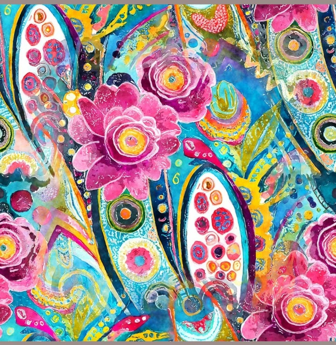 Vibrant fabric with pink flowers, paisley motifs, and colorful geometric patterns on blue background
