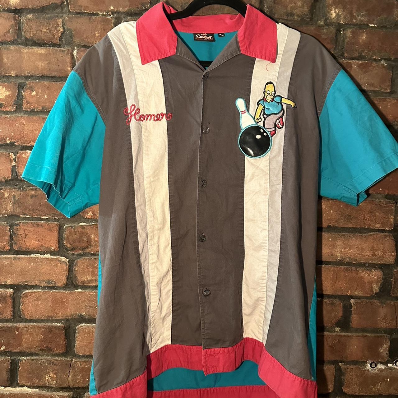 Vintage bowling shirt with Homer Simpson embroidery and colorful striped panels on brick wall