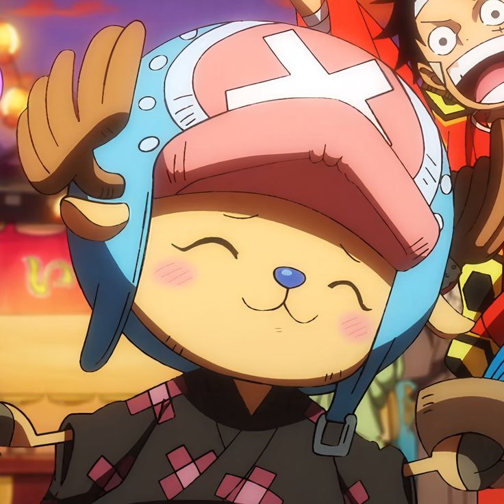Smiling anime reindeer character Chopper wearing a pink hat with blue accents and a happy expression