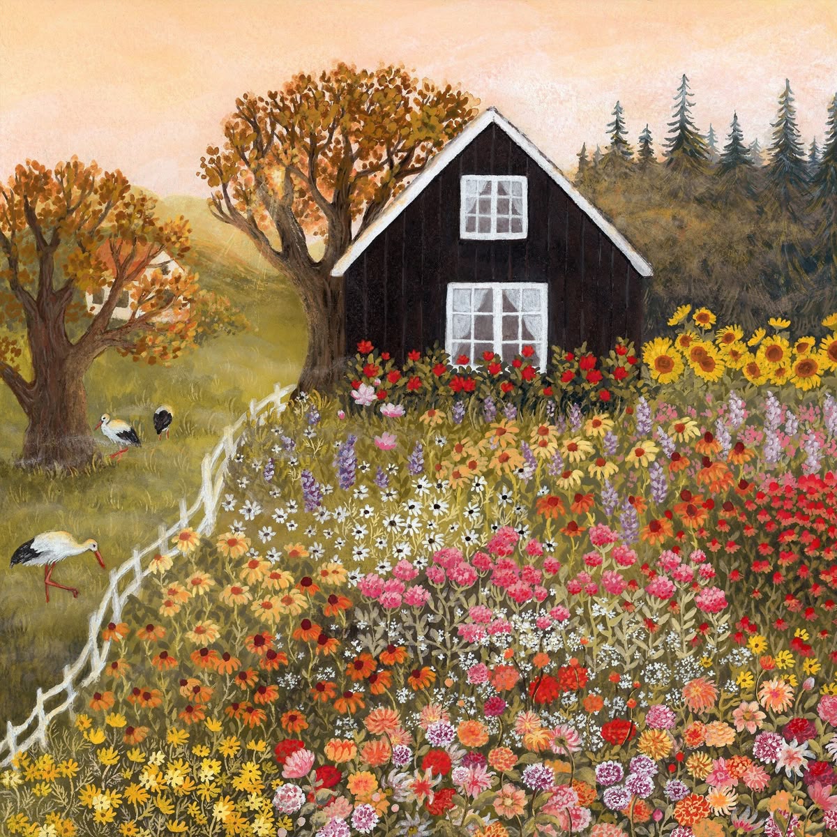 Black cottage with white trim surrounded by abundant colorful flower gardens on a hillside