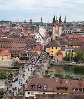 Aerial view of Würzburg, Germany with Old Main Bridge, red rooftops, and church spires
