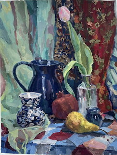 Oil painting of pink tulip in blue vase with teapot, fruit, and decorative fabrics