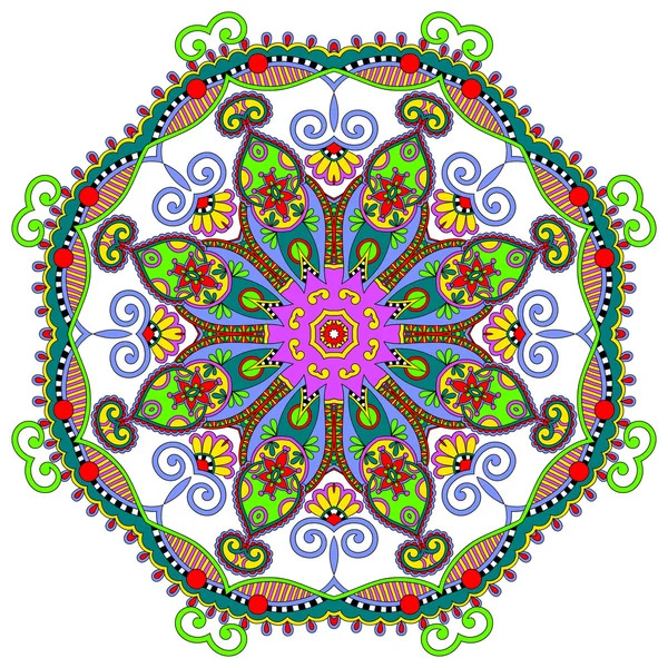 Ornate circular mandala with colorful floral motifs and swirling decorative elements in vibrant hues