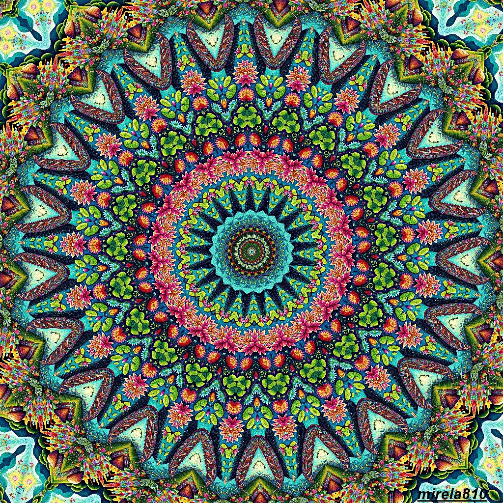 Colorful symmetrical mandala with turquoise, pink and green floral patterns in radial design