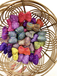 Colorful Yarn Skeins in Wicker Basket