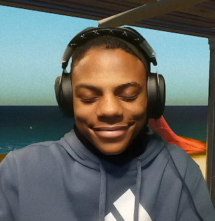 Smiling young man wearing headphones and a hoodie