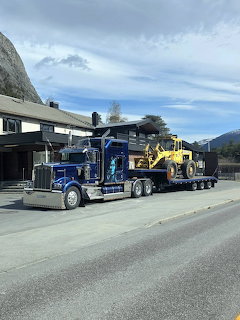 Semi Truck Hauling Excavator
