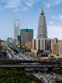 Riyadh cityscape with Kingdom Centre and Al Faisaliyah towers along a major highway