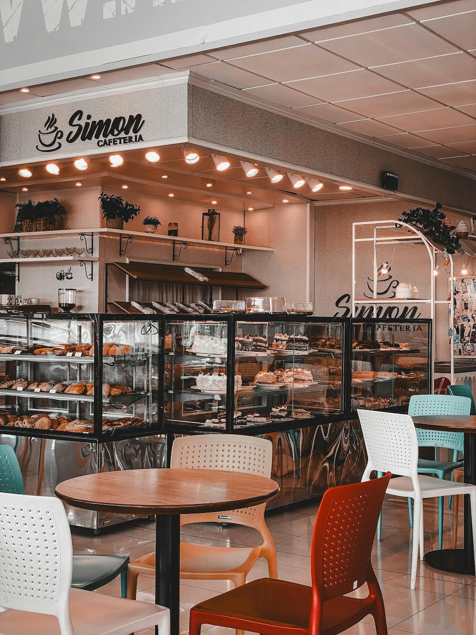 Interior of a cozy coffee shop with wooden counter and espresso machine