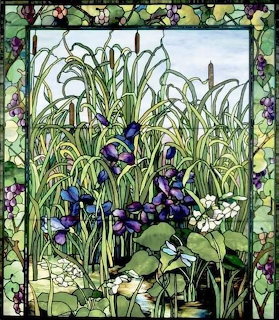 Stained glass panel with purple irises, white flowers, and decorative floral border in Tiffany style
