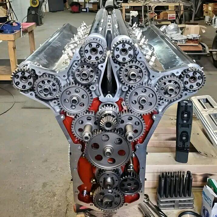 Disassembled V8 engine block with exposed internal components on a workbench