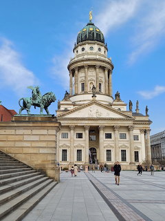 Französischer Dom cathedral with green dome and equestrian statue on Gendarmenmarkt, Berlin